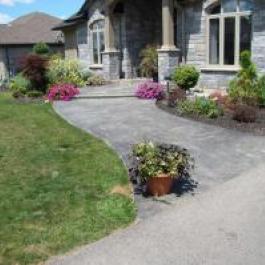 A new stamped, coloured concrete sidewalk.