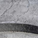 Grey patterned concrete front step.