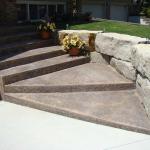 Armour stone retaining wall and new decorative concrete steps.