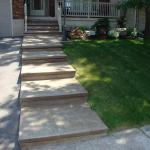 A decorative concrete sidewalk, coloured, and then stamped.