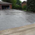 A new stamped, coloured concrete driveway.