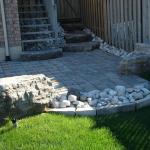 New patio with river rock and Armour Stone.