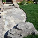 Stone sidewalk with Armour Stone.